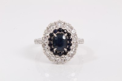 Lot 140 - 18ct white gold sapphire and diamond cluster ring