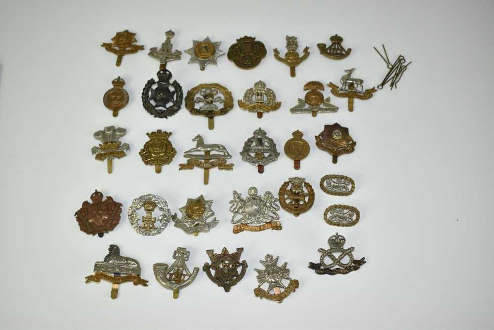 Lot 722 - Collection of thirty military cap badges to include Shropshire Yeomanry, Lincolnshire Reigment and Lincolnshire Yeomanry  (30 badges)