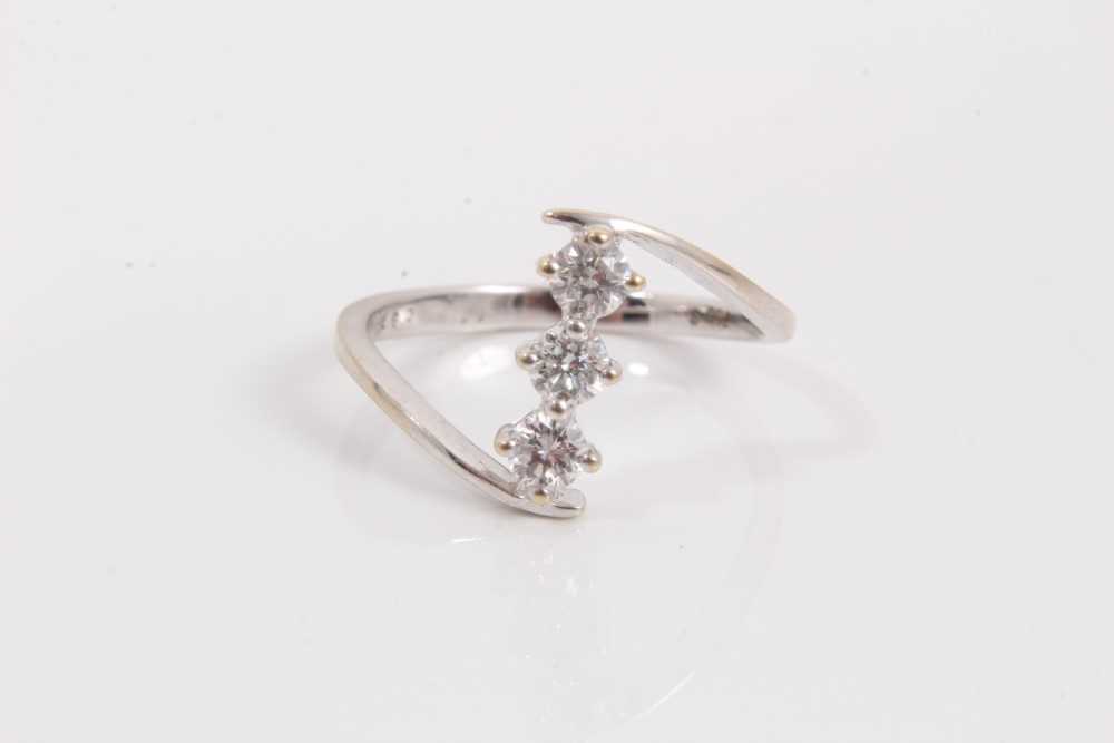 Lot 77 - 18ct white gold diamond three stone ring