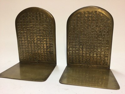 Lot 56 - Pair of Chinese brass bookends decorated with calligraphy and figures