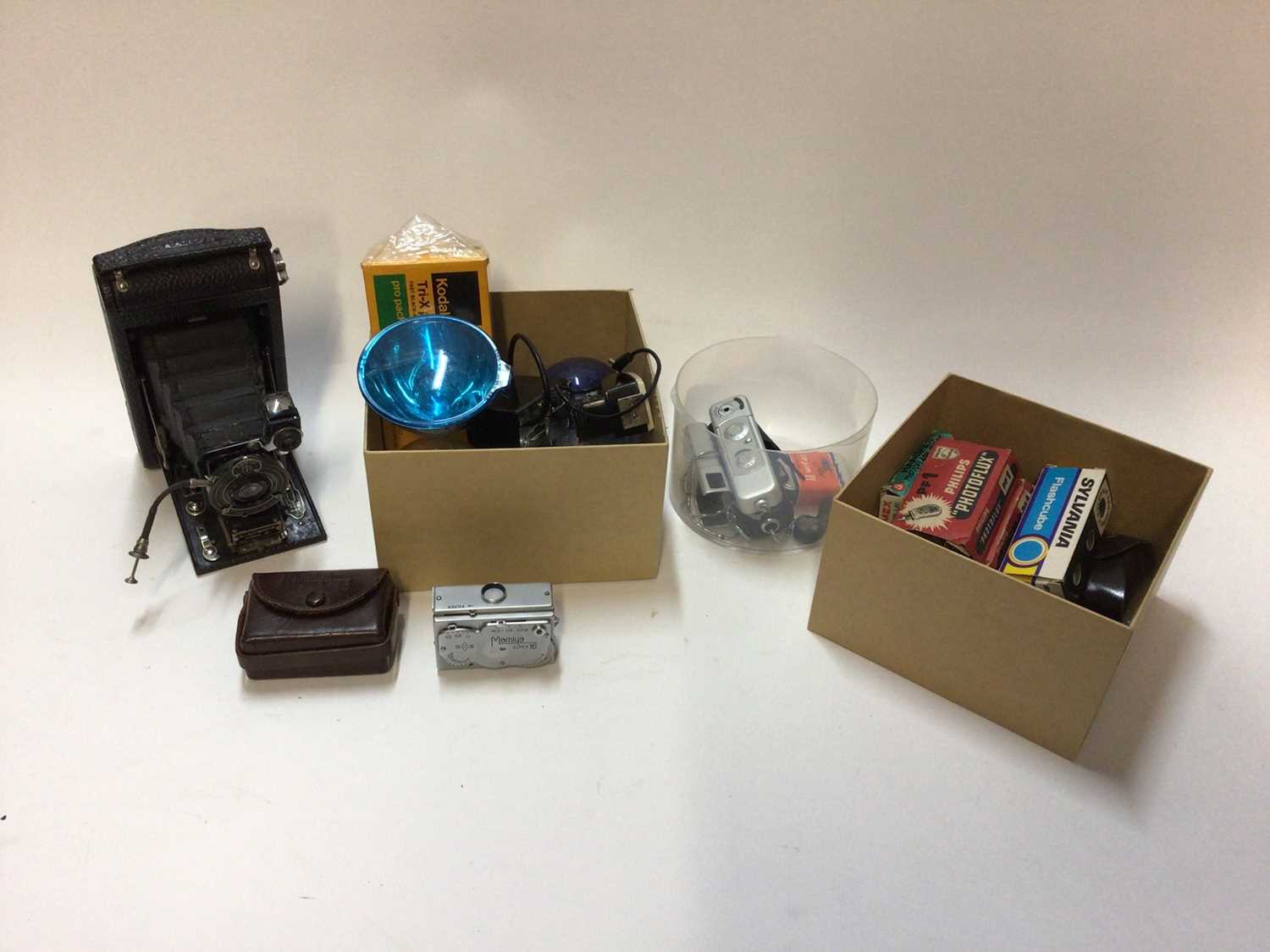 Lot 2365 - Group of cameras and accessories, including a Mamiya Super 16, Minox, Kodak Autographic, light meters, flash bulbs, etc