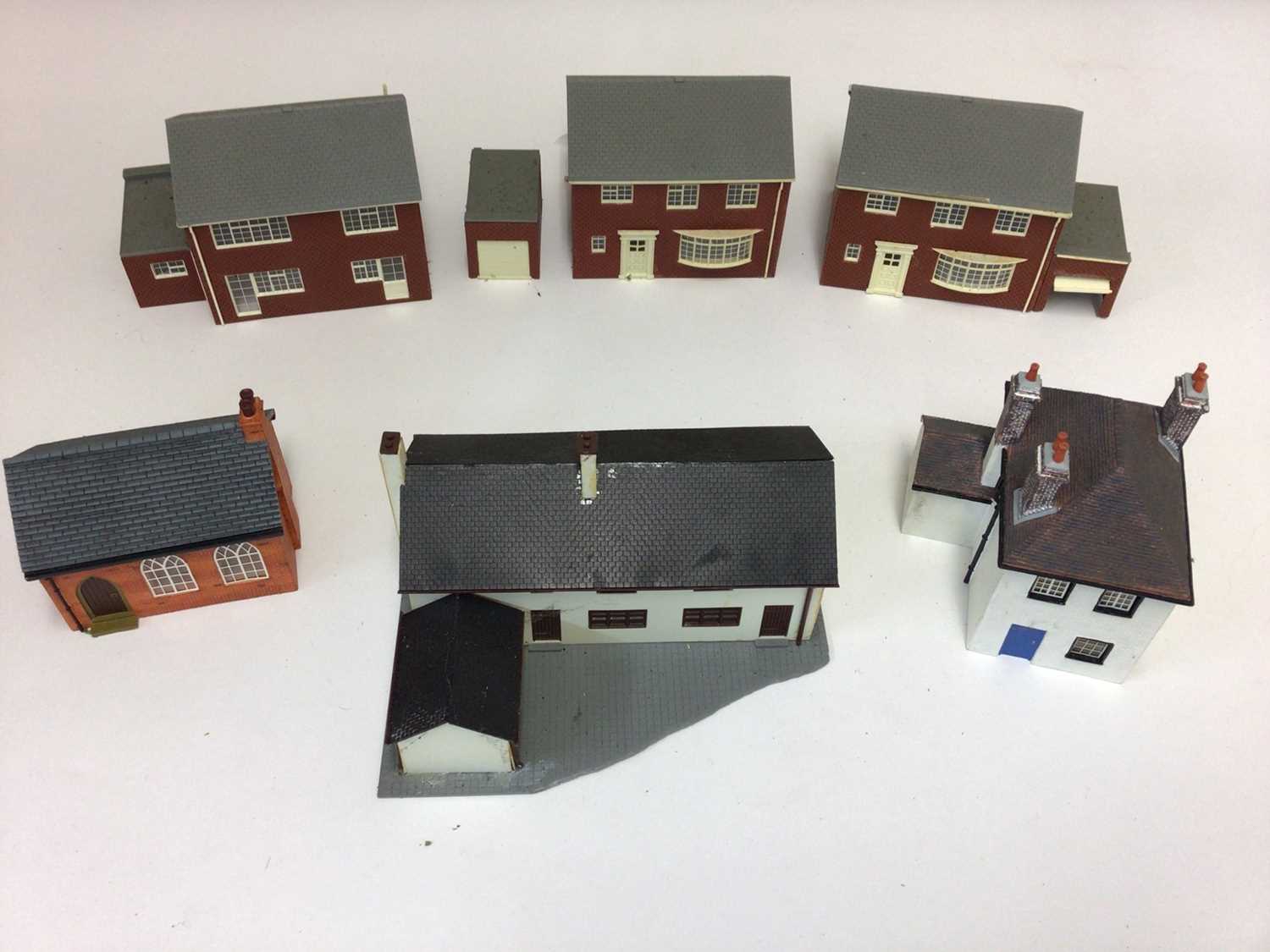 Lot 1887 - Selection of constructed Hornby model buildings plus cardboard houses, churches and other buildings (2 boxes)