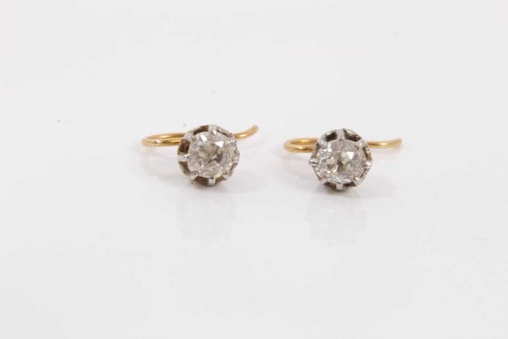 Lot 117 - Pair of antique diamond single stone earrings, each with an old cut diamond