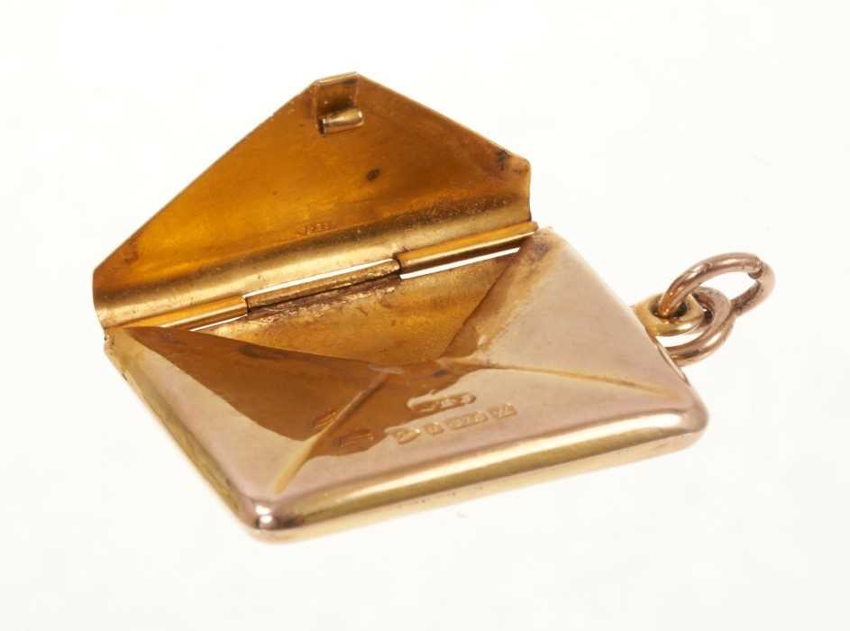 Lot 481 9ct gold stamp holder in the form of an