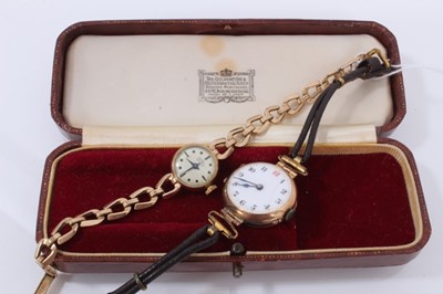 Lot 580 - Early 20th century Ladies 9ct gold cased wristwatch with white enamel with Arabic numerials, (Birmingham 1918) on a leather strap.