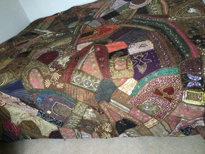 Lot 265 - Vintage Indian patchwork bed cover with lavish embroidery and beadwork.