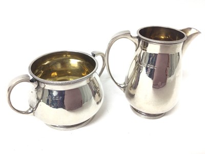 Lot 129 - 1920s Mappin & Webb silver three piece tea set