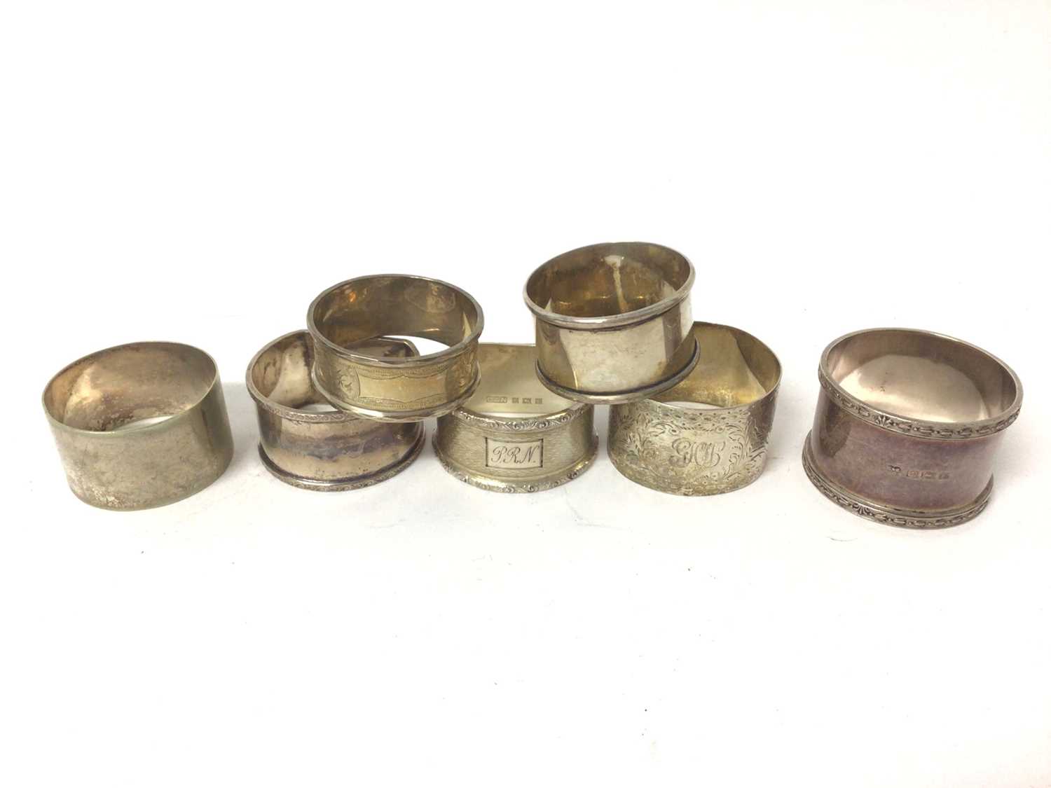 Lot 134 - Six various silver napkin rings and one silver plated (7)