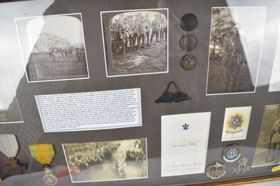 Lot 737 - First World War display mounted in glazed frame, containing piece of Zeppelin L32, shot down near Billericay, Essex, reproduction and period photographs, European medals, cap badges and buttons.