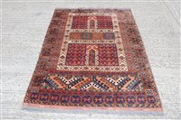 Lot 1208 - Tribal rug, the brick-red ground with...