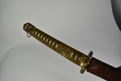 Lot 916 - Good quality Second World War Japanese Officers Katana sword with regulation mounts with silver Mon badge to pommel, signed tang with leather cover to lacquered wood scabbard , with modern engraved...