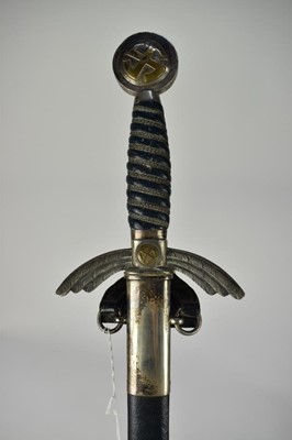 Lot 918 - 1930s Nazi Luftwaffe Officers sword by E & F Horster, Berlin with silver plated hilt and wire bound blue leather grip, double edged blade retaining all original polish, in original blue leather cov...