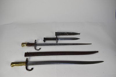 Lot 925 - French 1866 Pattern Chassepot bayonet with steel scabbard dated 1868, French Gras bayonet, and Swedish bayonet with scabbard (3)