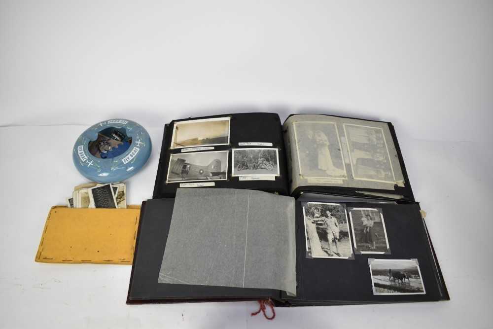 Lot 769 - Two Second World War photograph albums of various scenes of India and military service together with a collection of cloth military badges and a BOAC ashtray.