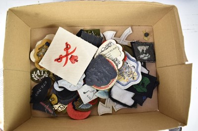 Lot 769 - Two Second World War photograph albums of various scenes of India and military service together with a collection of cloth military badges and a BOAC ashtray.