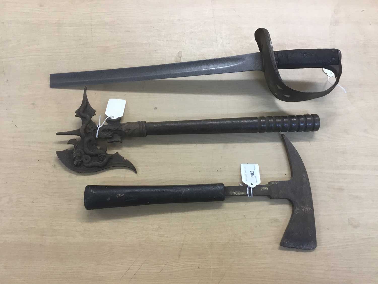 Lot 982 - Second World War fireman’s axe, eastern axe and the remains of a British sword