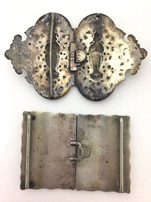 Lot 178 - Two Eastern white metal buckles