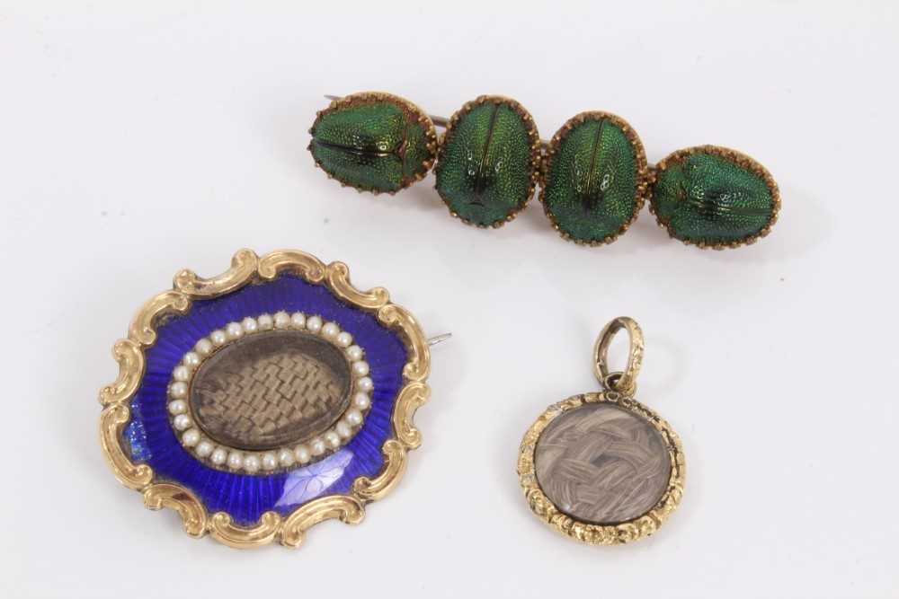 Lot 189 - Victorian blue enamel and seed pearl mourning brooch, similar Victorian locket pendant and an Egyptian Revival brooch mounted with four scarab beetles