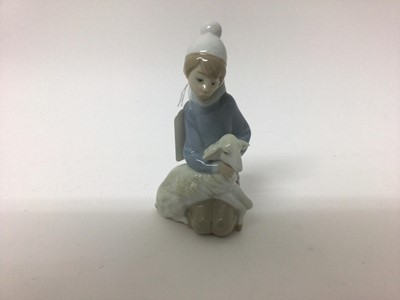 Lot 1367 - Lladro porcelain figure  - girl with lamb, together with six Nao figures another similar figure and Beswick Beatrix Potter figure - Flopsy Mopsy and Cottontail (9)