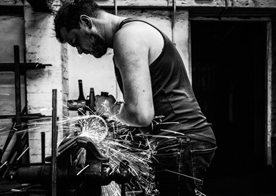 Lot 19 - Jayne Odell black and white photographic print, 'At the forge', 100cm x 71cm