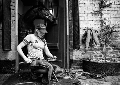 Lot 21 - Jayne Odell black and white photographic print, 'Making new shoes', 100cm x 71cm