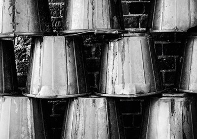 Lot 42 - Jayne Odell black and white photographic print, 'Feed buckets', 100cm x 71cm