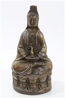 Lot 700 - Chinese bronze figure of Guanyin seated on...