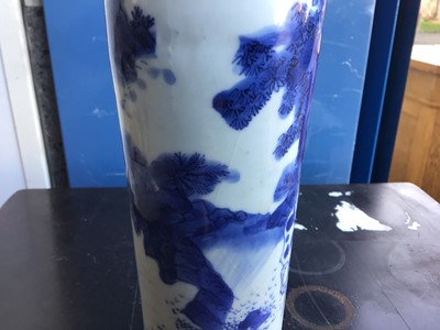 Lot 9 - A Chinese blue and white Transitional period sleeve vase, painted with a figure and horse in a landscape setting