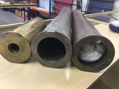 Lot 829 - Three large brass military shell cases