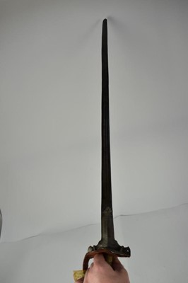 Lot 947 - Late 18th/ early 19th century Indian Firangi broad sword with steel bowl guard and long spur mount, straight multi fullered blade 116 cm overall