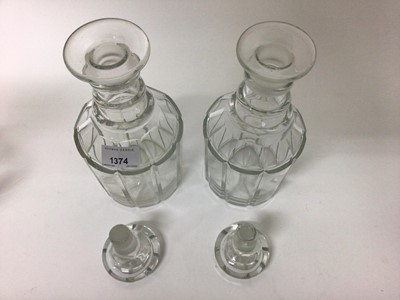 Lot 25 - Pair of 19th century glass decanters with triple ring necks and mushroom stoppers, together with another similar (3)