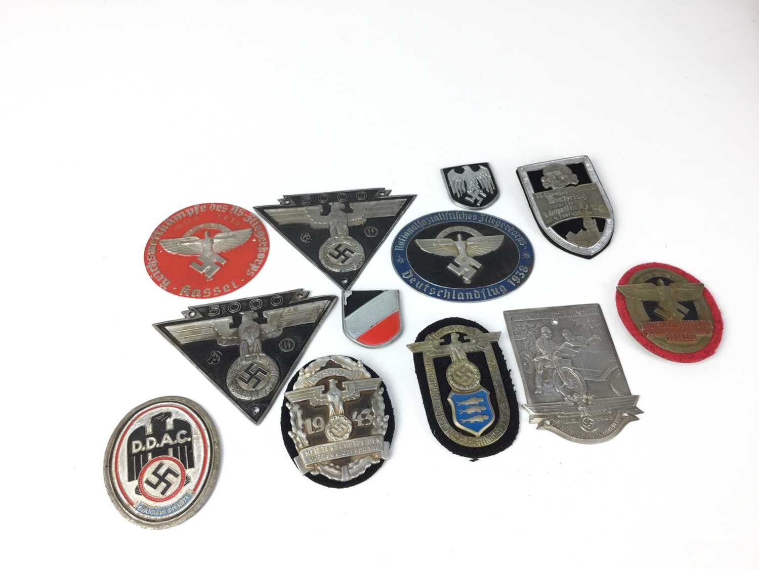 Lot 837 - Group of twelve Post War Nazi metal badges and plaques (12)