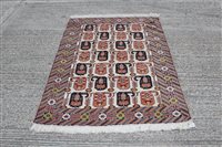 Lot 1202 - Tribal rug with four rows of seven serrated...