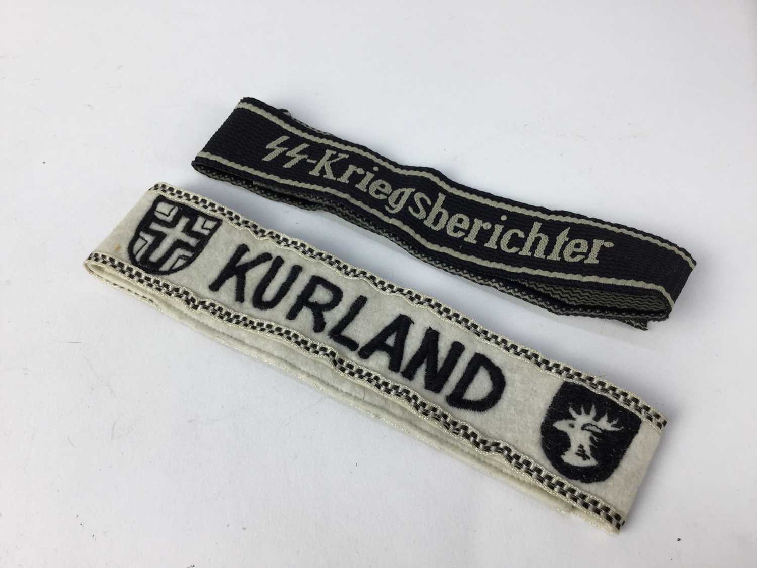 Lot 843 - Two Post War Nazi Cuff titles- Kurland and Kiegsherichter (2)