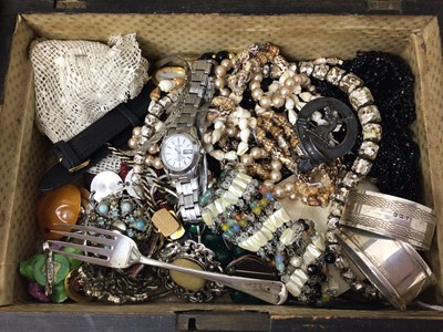Lot 251 - Vintage costume jewellery in a wooden sewing box, two silver napkin rings, silver cake fork, coins and other bijouterie
