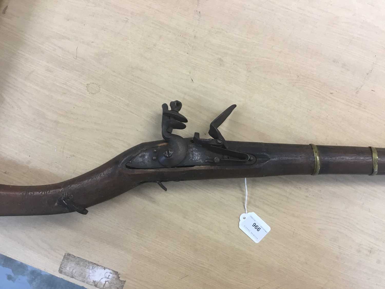 Lot 996 - 19th century Indian flintlock jazel musket with East India Company marked lock dated 1813, 107cm barrel with flared muzzle, full stocked 142 cm overall.