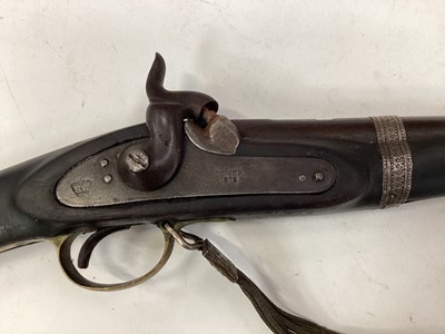 Lot 997 - 19th century Indian musket with Enfield lock dated 1878, V.R.I stamped stock with native decoration and alterations with decorative silver wire shoulder strap 142 cm
