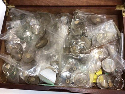 Lot 2581 - A large quantity of watchmaking parts including movements, cases, dials, glasses, etc