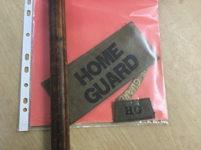 Lot 984 - Second World War British Home Guard pike with Lance tip and wooden shaft , Home Guard arm band, and cloth badges (4)