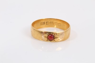 Lot 275 - 22ct gold wedding ring set with a red cabochon