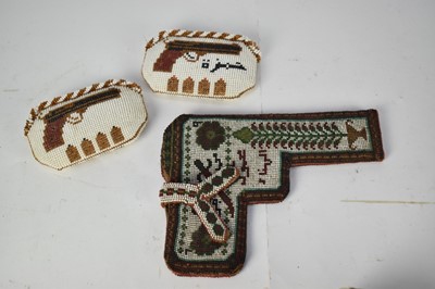 Lot 640 - Beadwork holster together with two beadwork purses depicting pistols, manufactured by Syrian Prisioners of War (3)