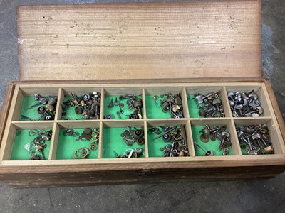 Lot 593 - Large collection of watch and clock components and tools, including stacking drawers of pocket watch parts and various other items.