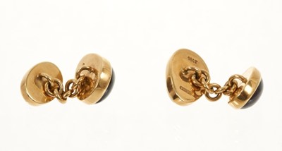 Lot 456 - Pair of 18ct gold garnet cabochon cufflinks