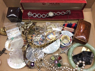 Lot 361 - Group of costume jewellery and bijouterie including vintage buckles and spectacles, wristwatches, badges and a green hard stone bangle