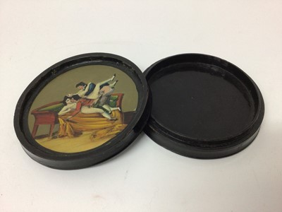 Lot 208 - Regency circular papier-mâché erotic table snuff box of circular form with painted dog chasing a duck to lid and erotic scene to the interior 9 cm diameter