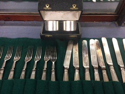 Lot 815 - Set of twenty silver handled knives and forks, together with two silver napkin rings in fitted cased