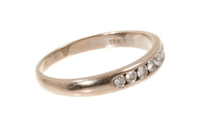 Lot 496 - Diamond eternity ring with seven brilliant cut diamonds in 18ct white gold channel setting
