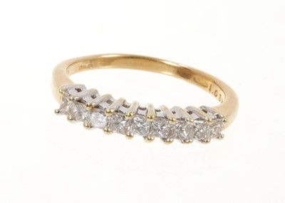 Lot 514 - Diamond eternity ring with a half hoop of nine princess cut diamonds in claw setting on 18ct yellow gold shank. Estimated total diamond weight approximately 1ct.