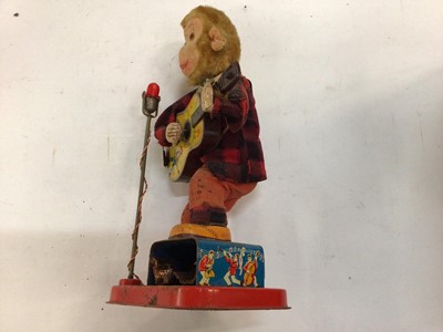 Lot 1973 - Japanese tinplate automaton toy battery operated Monkey with guitar.