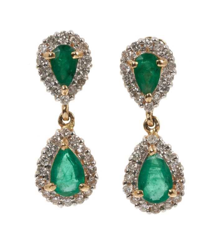 Lot 475 - Pair of emerald and diamond pendant earrings, each with two pear cut emeralds surrounded by borders of brilliant cut diamonds in 14ct gold setting.